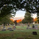 Colestown Cemetery with autumn foliage in background