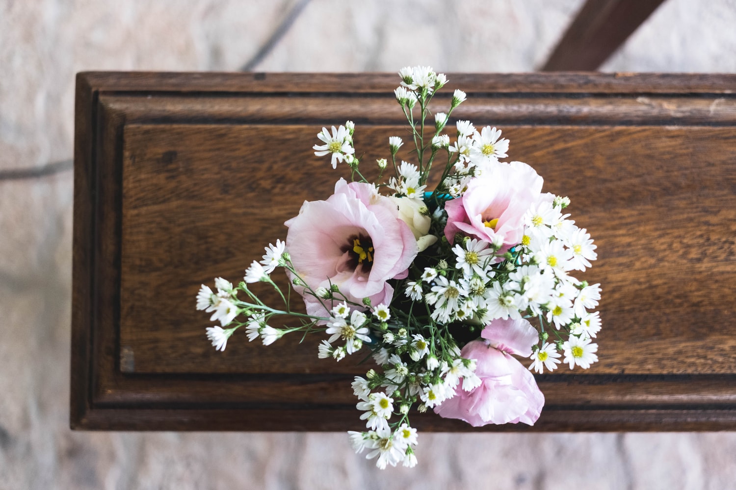 casket with flowers on top